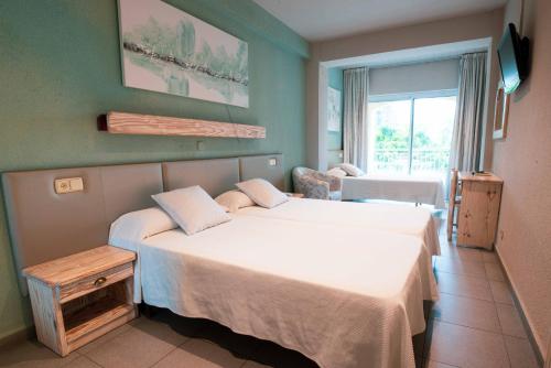 Postel nebo postele na pokoji v ubytování Hotel S'Agoita