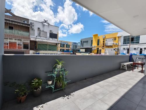 a view from the balcony of a apartment with plants at Shoreline Guesthouse 海岸线客栈 in Semporna