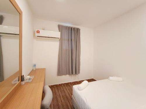 Postel nebo postele na pokoji v ubytování Shoreline Guesthouse 海岸线客栈