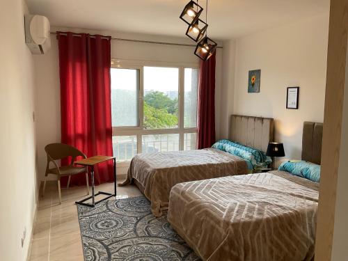 Postel nebo postele na pokoji v ubytování Madinaty B12 Shared Apartment With Private Rooms - One minute from Mall - غرفة خاصة في شقة مشتركة