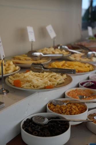 a buffet with many different types of food on plates at Ring Stone Hotels Bosphorus - Special Class in Istanbul