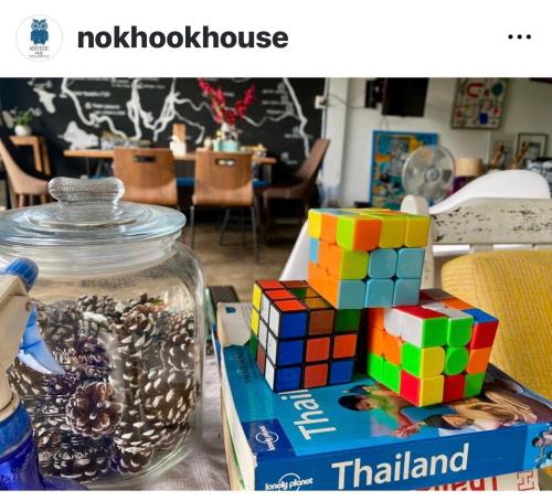a mason jar with a colorful toy on a table at Nokhook House in Trang