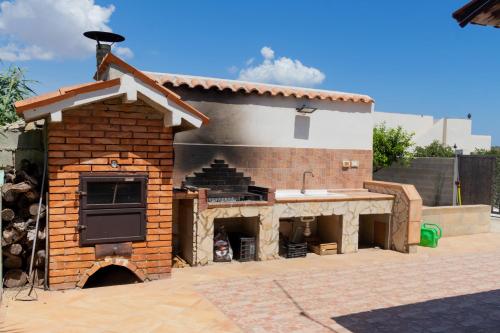 a model of a house with a brick oven at Amaris Mango Seafront Villa in Granelli