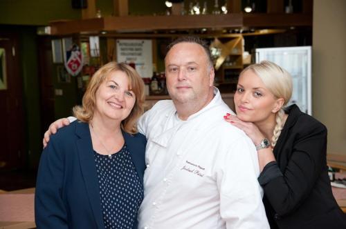 a man and two women posing for a picture at Pension Pegast in České Budějovice