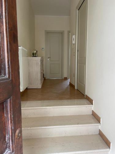an empty room with a staircase and a door at Casa Bucciarelle in Casoli