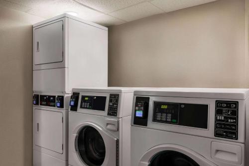 two washing machines in a laundry room with at Days Hotel by Wyndham Allentown Airport / Lehigh Valley in Allentown