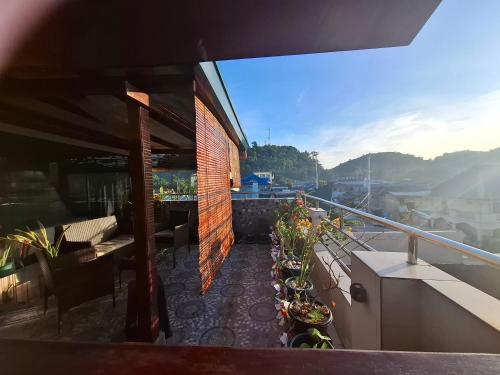 a balcony of a building with plants on it at Luxury Penthouse With View&Starlink in Dapa
