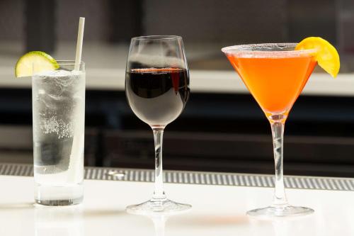 two glasses of drinks sitting on a table at Hilton Garden Inn Spokane Airport in Airway Heights