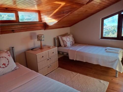 Ένα ή περισσότερα κρεβάτια σε δωμάτιο στο Almond Tatil Evi