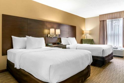 Ένα ή περισσότερα κρεβάτια σε δωμάτιο στο Quality Inn & Suites Monroe