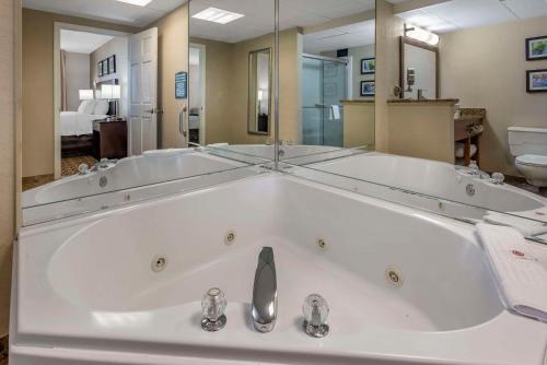 a large white bath tub in a bathroom at Comfort Inn & Suites Glen Mills - West Chester in Glen Mills
