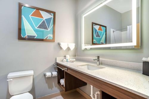 a bathroom with a sink and a mirror at Comfort Inn Miramar Beach-Destin in Destin