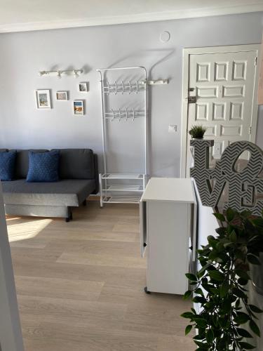 a living room with a couch and a table at Sweet home Salou in Salou
