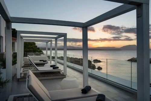 a balcony with a view of the ocean at The Ocean Club, a Luxury Collection Resort, Costa Norte in Sosúa