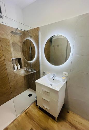 a bathroom with a sink and a mirror at The Green Terrace in Bajamar