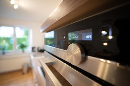 a microwave oven sitting on top of a counter at Stilvolle Maisonette mit Charme in Bad Honnef am Rhein