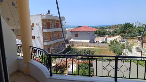 a balcony with a view of a building at Nitro Inn Orikum - SEA and GARDEN in Orikum