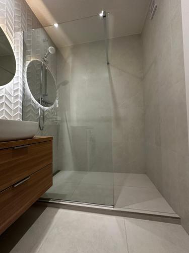 a bathroom with a shower with a glass door at SILVER apartment - Rezidencia Bojnice in Bojnice