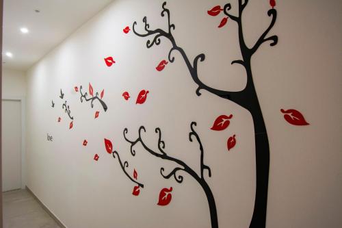 a tree of hearts wall sticker in a room at SMART Rooms Pistoia in Pistoia