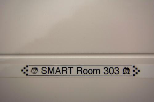 a sign on the ceiling of a room at SMART Rooms Pistoia in Pistoia