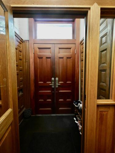 a door to a room with shoes in a closet at 2 bedrooms with one private bathroom in lovely home in New York