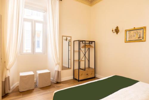 a bedroom with a bed and a window at Pantheon Apartments - Piccola Roma in Rome