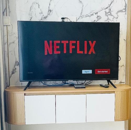a television with the word netflix on the screen at Căn hộ VINHOMES GRAND PARK, Hồ Chí Minh city in Long Bình