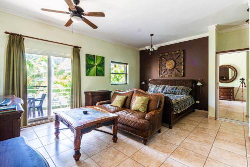 a living room with a couch and a table at Ocean Dream Studios, kiters paradise! in Cabarete