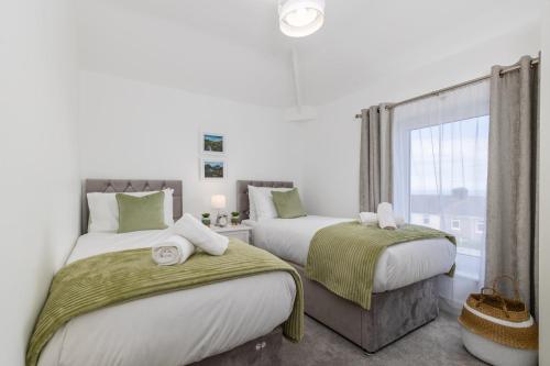 Ένα ή περισσότερα κρεβάτια σε δωμάτιο στο Tranquil House with Sea Views