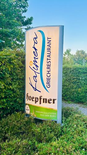 a sign for the headquarters of the hamburg defender at Daheim am Wasserturm in Wörth am Rhein