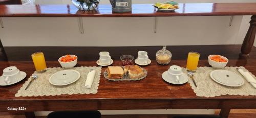 a table with plates and food on top of it at Solara Art Hotel by Amak in Cusco