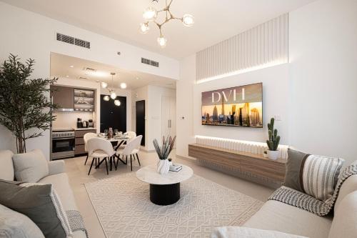 a living room with a couch and a table at Burj Crown - Urban Chic Opera Boulevard View, Walk to Dubai Mall in Dubai