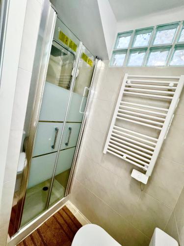 a bathroom with a shower and a toilet at Apt Kandinsky Mallorca in S'Illot