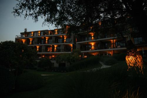a hotel at night with its lights on at Hotel Seehof Nature Retreat in Naz-Sciaves