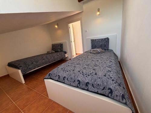 a bedroom with two beds in a room at Casa Mica in Albox