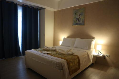 Postel nebo postele na pokoji v ubytování Hotel Casa Ilustre