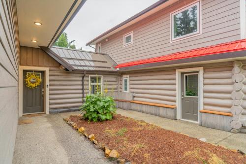 a house with a garage with a driveway at The Chetana Ridge Cabin in Fairbanks