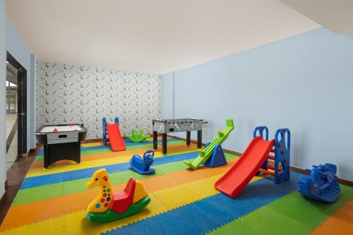 a play room with a bunch of playground equipment at Essentia Luxury Resort & Spa Udaipur in Udaipur