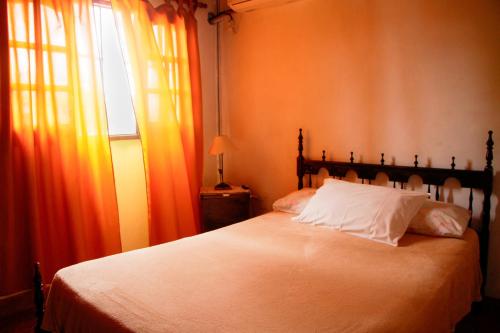 Postel nebo postele na pokoji v ubytování Hostal San Jorge