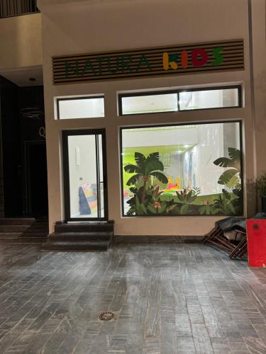 a store front with a big window with plants in it at Résidence Natura Living au parc in Mohammedia