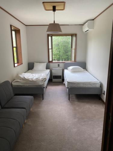 Postel nebo postele na pokoji v ubytování Guesthouse SÁPMI