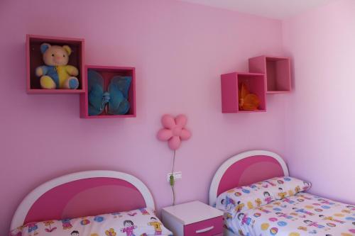 Postel nebo postele na pokoji v ubytování O Faro de Corrubedo