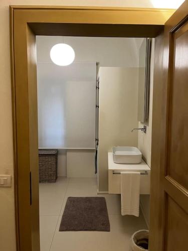 a small bathroom with a sink and a toilet at Antica Foligno - Novellis de coarazze in Foligno
