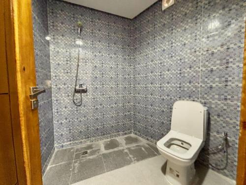 a bathroom with a shower and a toilet in it at Cabane Ouirgane in Aït Zat