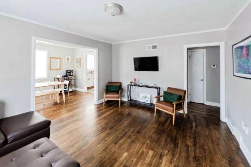 a living room with a couch and a table at E, Memphis Home 5 min from I240W in Memphis
