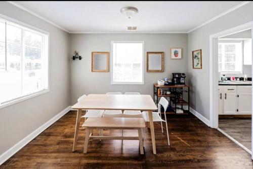 a dining room with a table and chairs at E, Memphis Home 5 min from I240W in Memphis