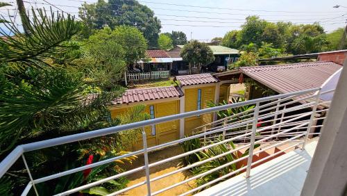 a view of a yellow house from a balcony at Casa turistica Portones del mirador in Monterrey