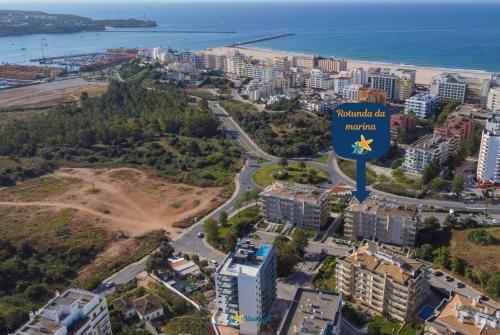 an aerial view of the city of antipolis with a sign that reads antipolis at Rotunda da Marina in Portimão