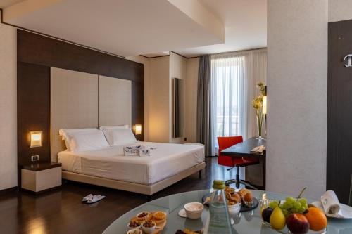 Postel nebo postele na pokoji v ubytování Hotel Valentino