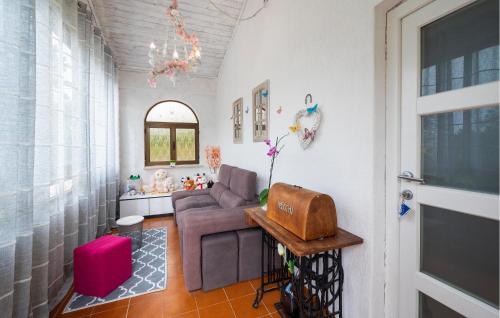 a living room with a couch and a chair at Gorgeous Home In Labin in Labin